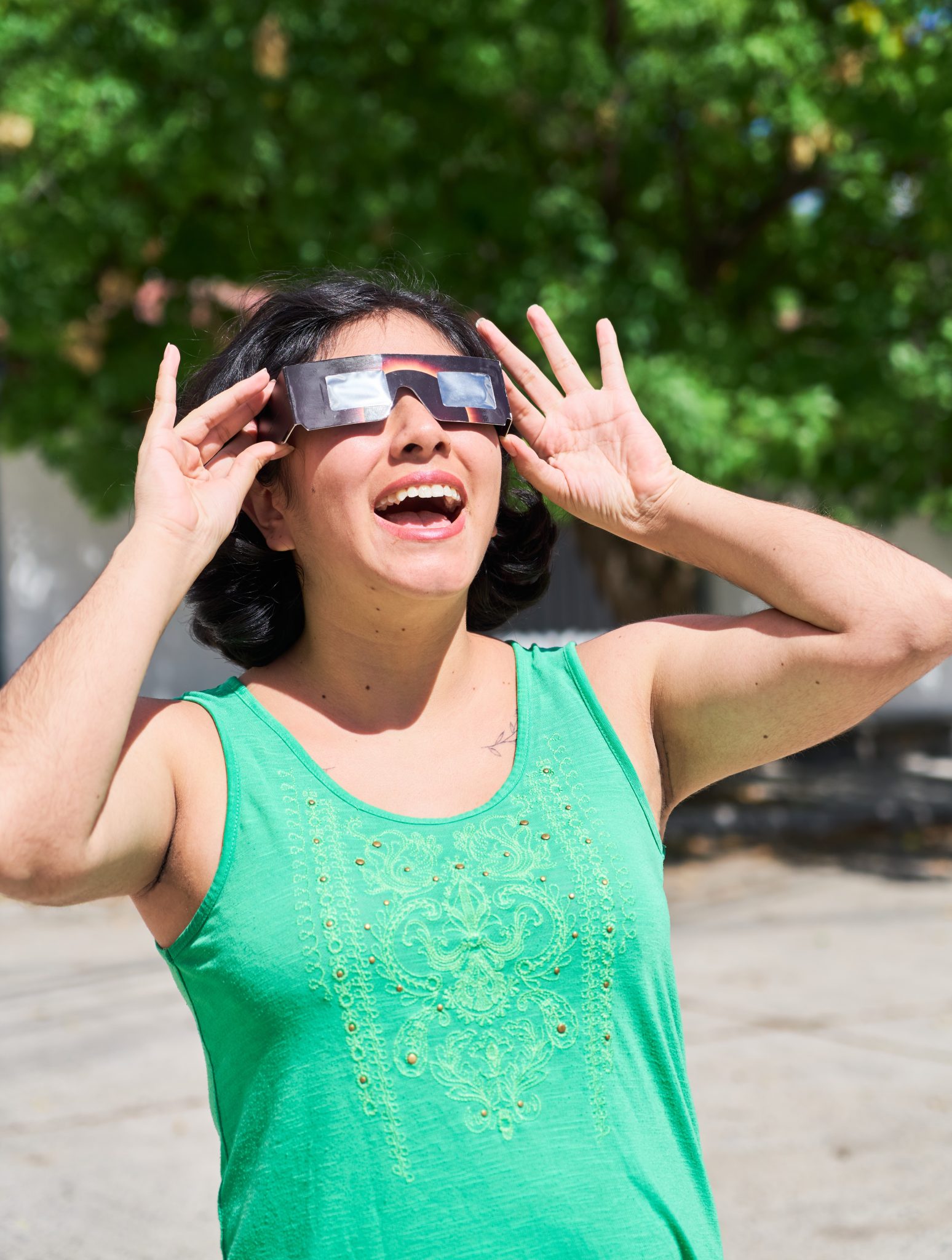 Photo of woman looking at eclipse
